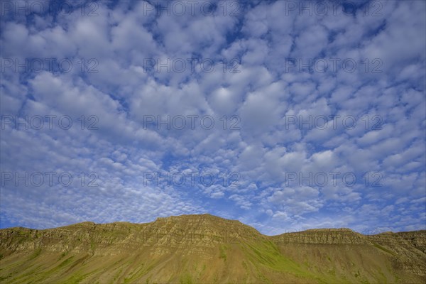 Sheep clouds and mountains in the evening light