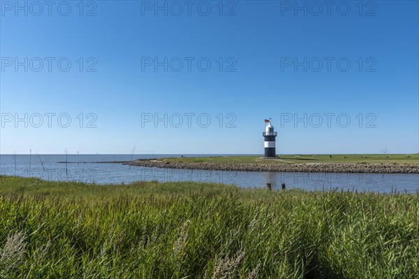 Coastal landscape with the Kleiner Preusse lighthouse in the background