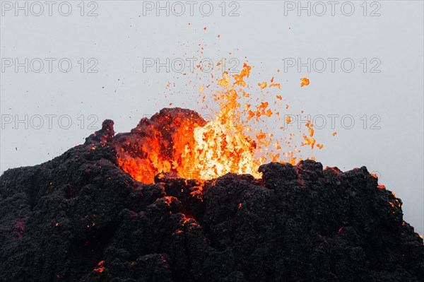 Erupting volcano with lava