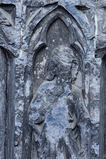 Old sculptures in need of renovation at the entrance gate to Notre-Dame Cathedral in Tournai