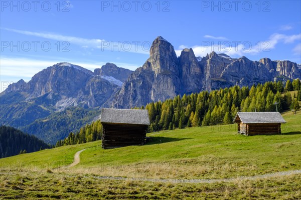 Mountain huts and sassongher from the Pralongia plateau