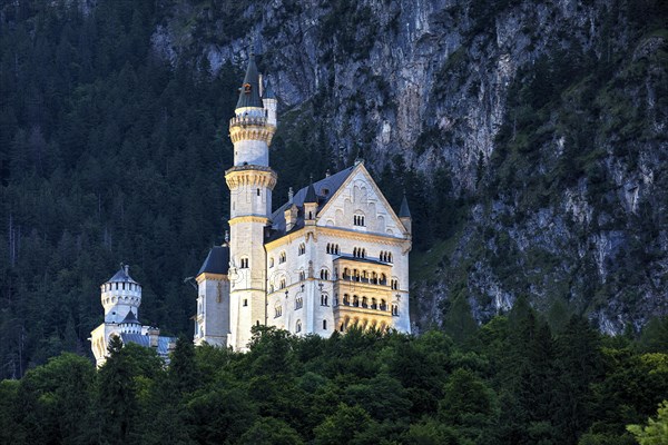 Illuminated Neuschwanstein Castle in the last evening light