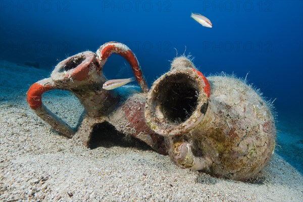 Two ancient amphorae on sandy seabed