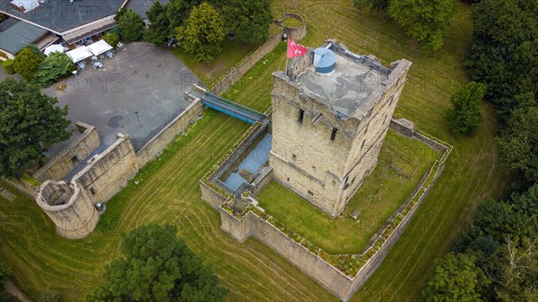 Fortified castle tower of ruin of partly reconstructed former moated castle Burg Altendorf from the Middle Ages