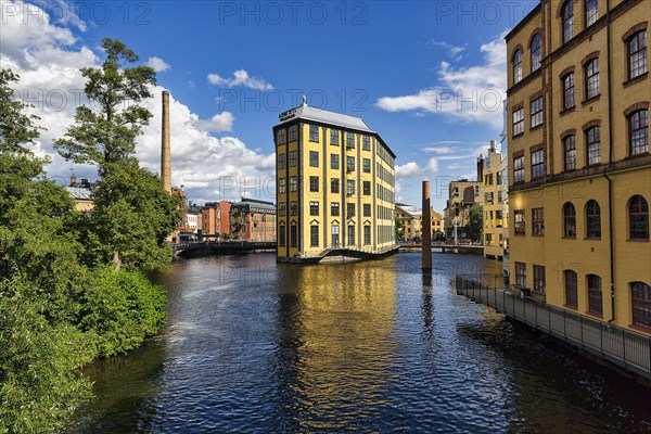 Former factory building Styrkjaern on the island of Laxholmen in the Motala stroem river