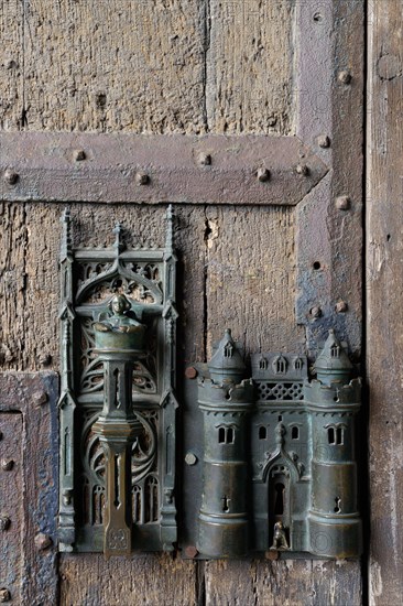 Door knocker and door lock on the gate of the town hall in Mons
