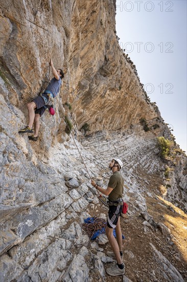 Climbing a rock face