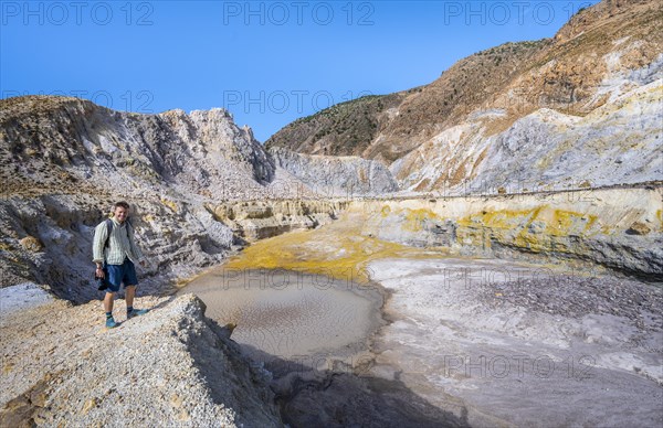 Young man at the crater rim