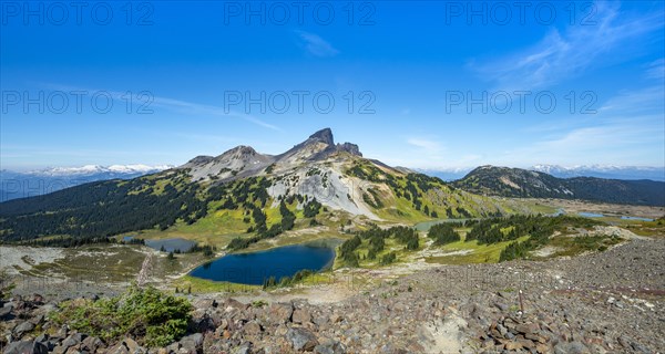 Blue lakes in front of Black Tusk volcanic mountain