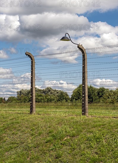 Barbed-wire fence and lamppost at Auschwitz II-Birkenau concentration camp