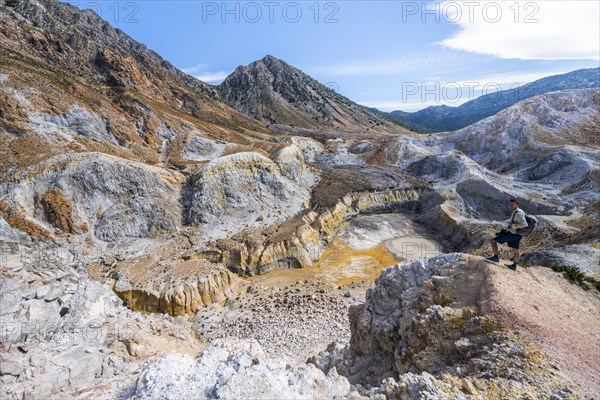 Young man at the crater rim