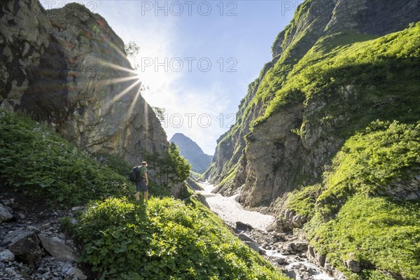 Hikers by a stream