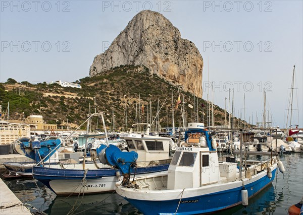 Boats and yachts at Calp (Calpe) harbor and Penyal d'Ifac rock
