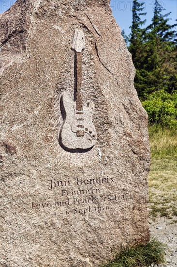 Memorial stone with inscription and relief of an electric guitar by Jimi Hendrix