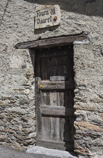 Old door with Occitan inscription