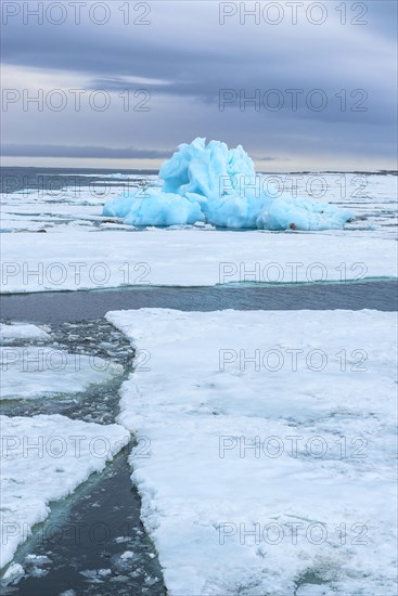 Blue iceberg drifting in Hinlopen Strait