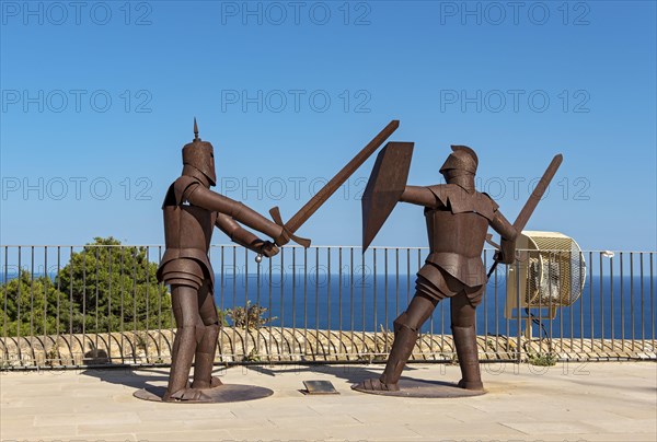 Metal statues of knights in armor