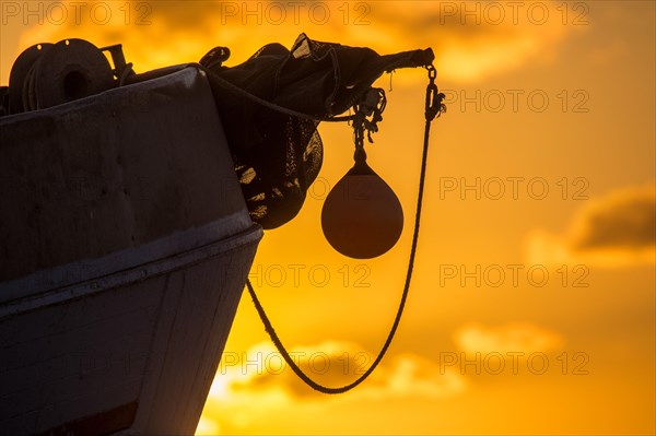 Fishing boat in sunset