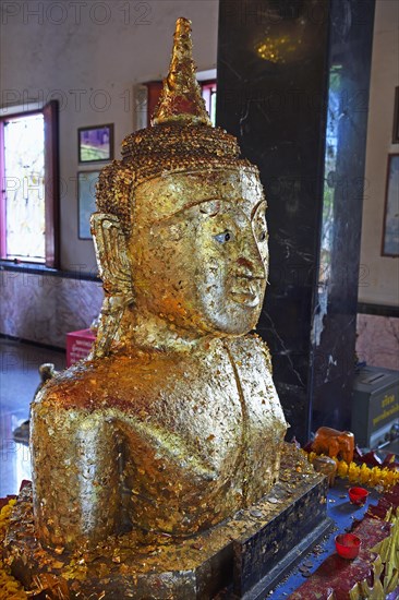 Buddha statue covered with gold leaf