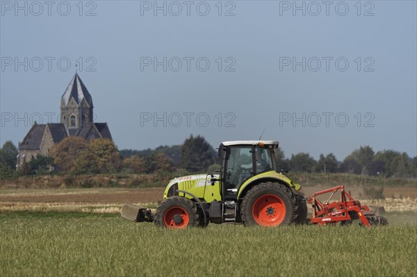 Farmer is cultivating field