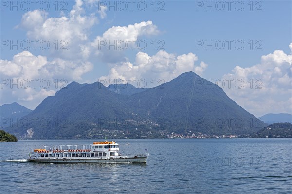 Excursion boat in front of Monte Sasso del Ferro