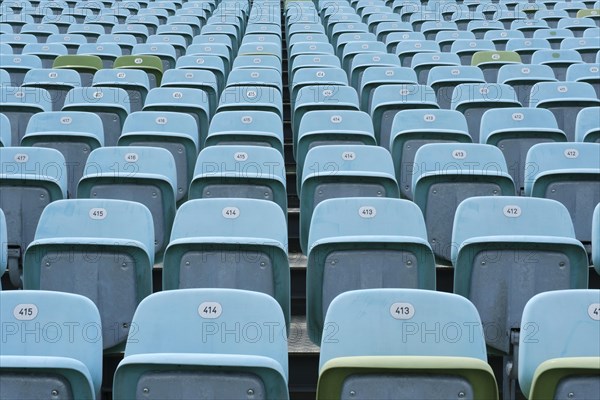 Blue and occasional green folding seats on the grandstand of the Seebuehne