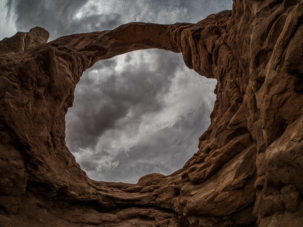 Thunderclouds over rock formations of the Windows Selection