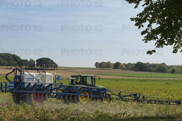 Farmer spraying pesticides