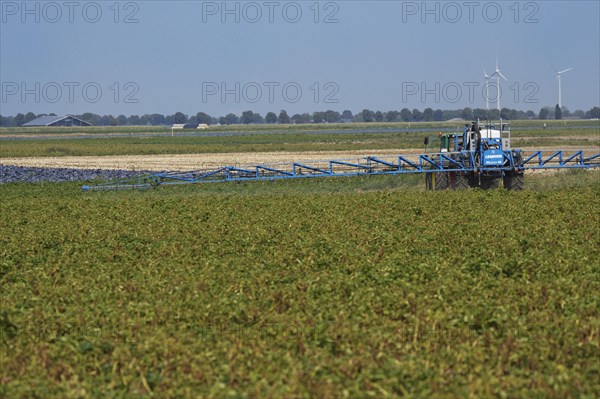 Farmer spraying pesticides