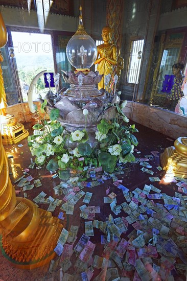 The holy of holies with banknotes as donations