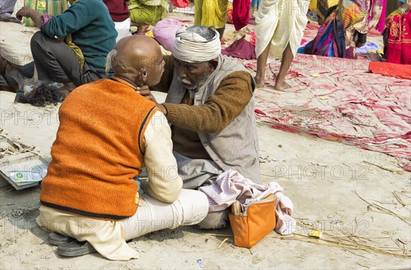 Outside the barbershop during the Allahabad Kumbh Mela