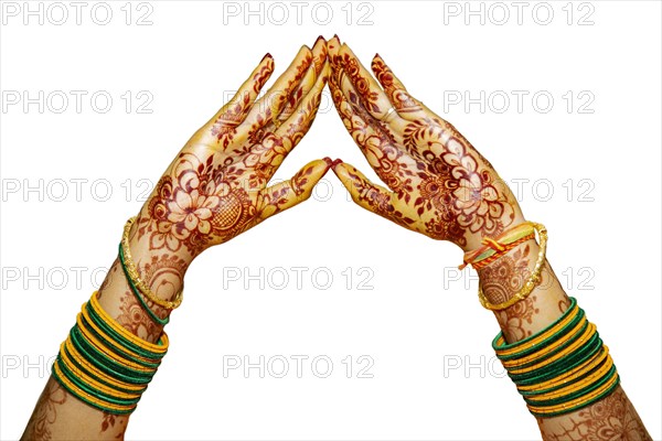 Indian Bride's hand painted with mehndi isolated on white background. Mauritius
