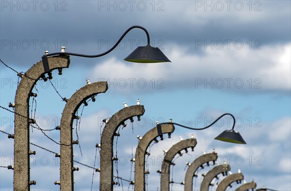 Barbed-wire fence and lampposts at Auschwitz II-Birkenau concentration camp