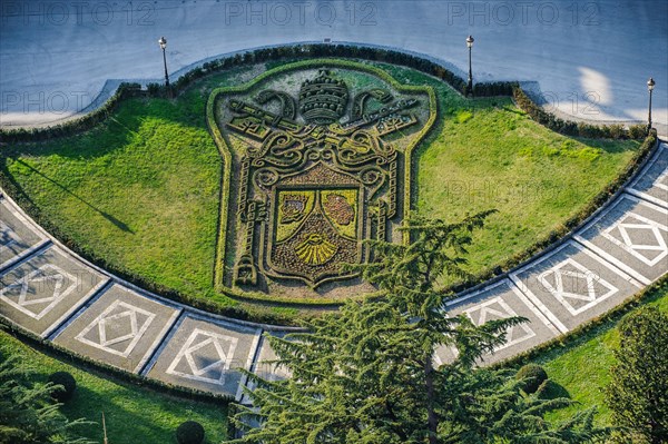Papal coat of arms of Pope Benedict XVI in the form of flowerbed next to St. Peter's Basilica