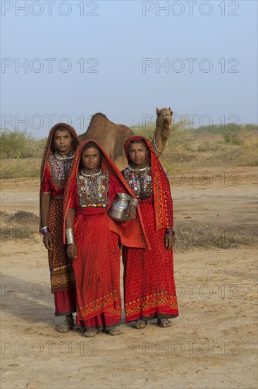 Fakirani woman in traditional dress with a water jug