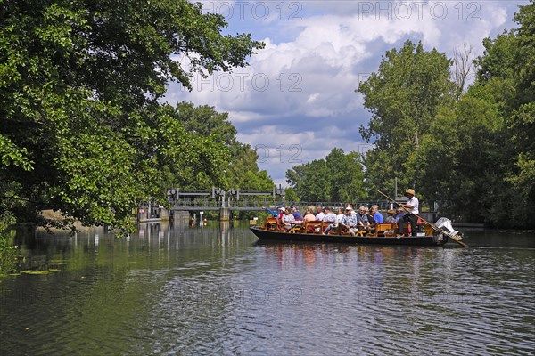 Tourists in typical barges along the Spree