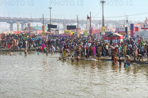 Pilgrims waiting to step into the Ganges for ritual bathing