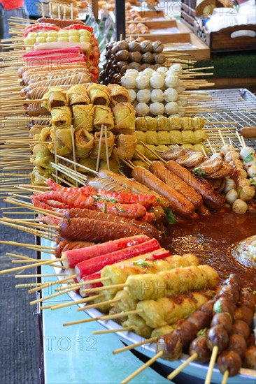 Various skewers with meat and seafood