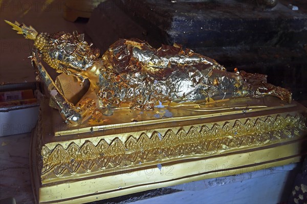 Buddha statue covered with gold leaf