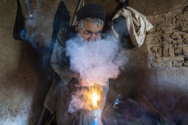 Sufi man smoking marihuana