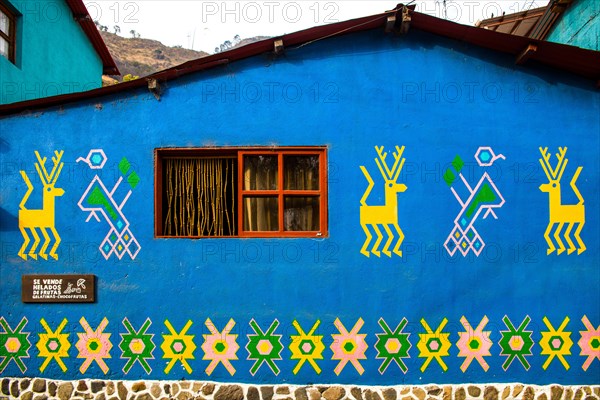 Houses painted with traditional Mayan patterns