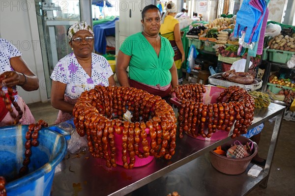 Market woman at the sausage stand