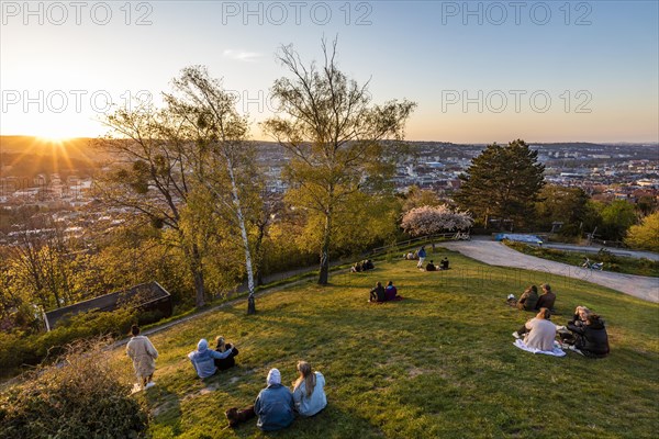 People at sunset in Weissenburgpark