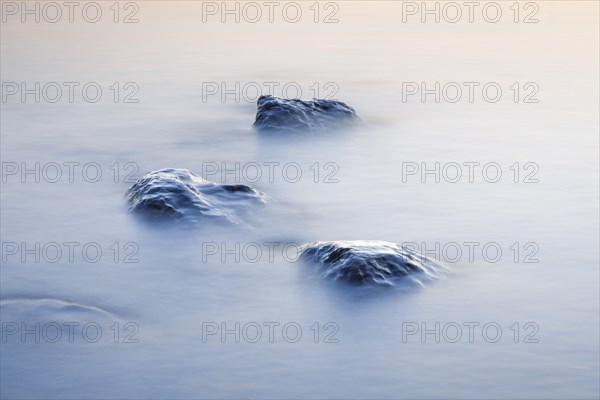 Stones in water photographed with slow shutter speed
