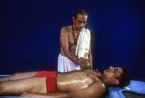 Indian ayurvedic oil massage Kizhi treatment in Kerala