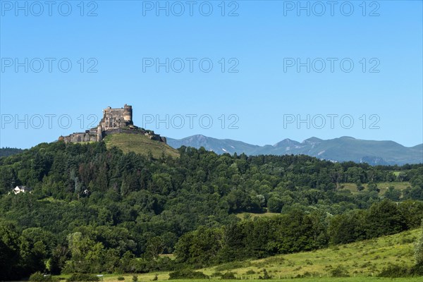 Castle of Murol and view on Sancy massif in Auvergne Volcanoes Natural Park