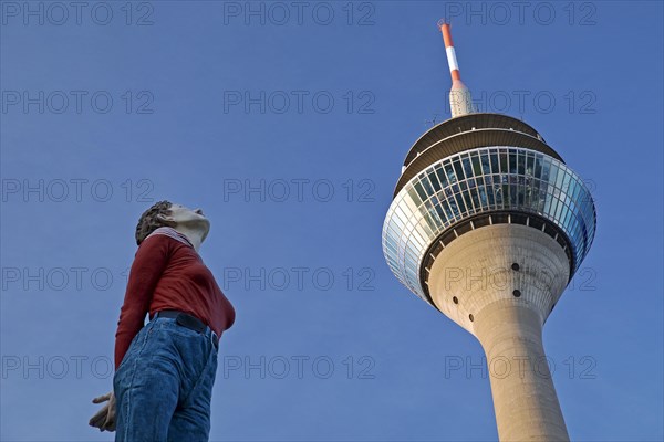 The sculpture Pillar Saint Marlis by Christoph Poeggeler looks up to the Rhine Tower