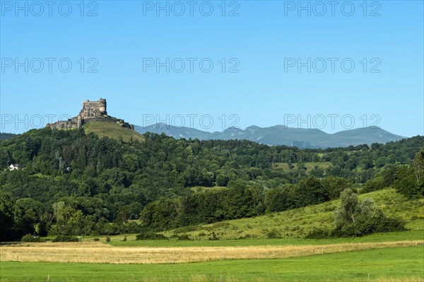 Castle of Murol and view on Sancy massif in Auvergne Volcanoes Natural Park