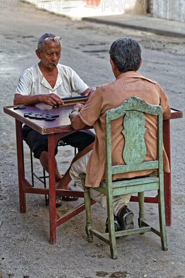 Two dark-skinned old men