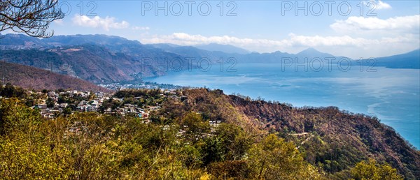 Lake Atitlan framed by volcanoes